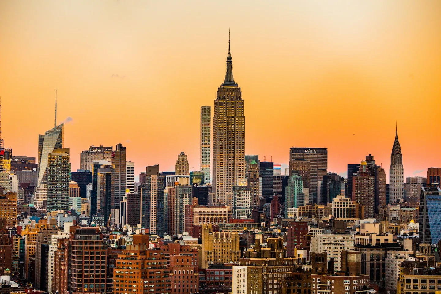Midtown Manhattan skyline with the Empire State Building and Chrysler Building at sunset